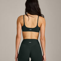 SoftMotion™ Strappy Sports Bra with Gray Logo | Emerald Noir