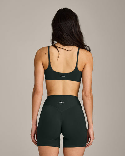 SoftMotion™ Strappy Sports Bra with Gray Logo | Emerald Noir