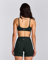 SoftMotion™ Strappy Sports Bra with Gray Logo | Emerald Noir
