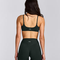 SoftMotion™ Strappy Sports Bra with Gray Logo | Emerald Noir