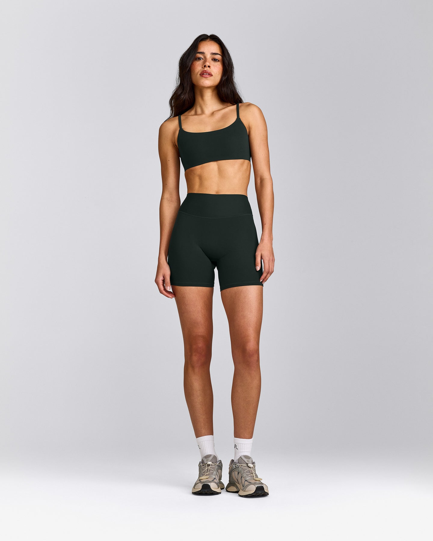 SoftMotion™ Strappy Sports Bra with Gray Logo | Emerald Noir