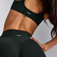 SoftMotion™ Strappy Sports Bra with Gray Logo | Emerald Noir