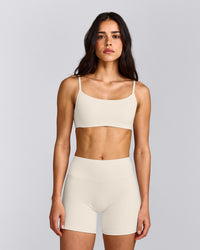 SoftMotion™ Strappy Sports Bra with Gray Logo | Marshmallow White