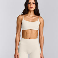 SoftMotion™ Strappy Sports Bra with Gray Logo | Marshmallow White