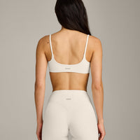 SoftMotion™ Strappy Sports Bra with Gray Logo | Marshmallow White