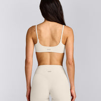 SoftMotion™ Strappy Sports Bra with Gray Logo | Marshmallow White