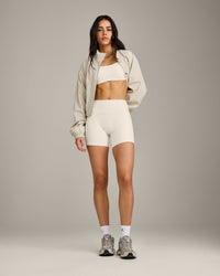 SoftMotion™ Strappy Sports Bra with Gray Logo | Marshmallow White