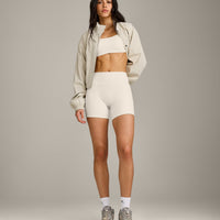 SoftMotion™ Strappy Sports Bra with Gray Logo | Marshmallow White