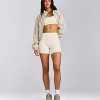 SoftMotion™ Strappy Sports Bra with Gray Logo | Marshmallow White