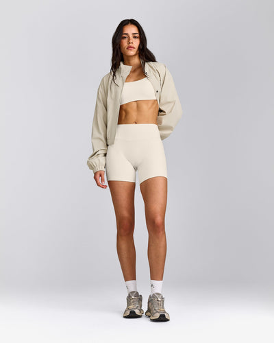 SoftMotion™ Strappy Sports Bra with Gray Logo | Marshmallow White