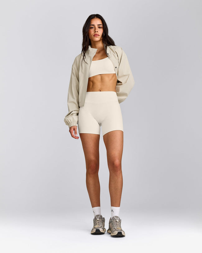 SoftMotion™ Strappy Sports Bra with Gray Logo | Marshmallow White