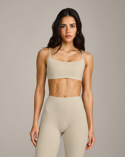 SoftMotion™ Strappy Sports Bra with Gray Logo | Oatmeal