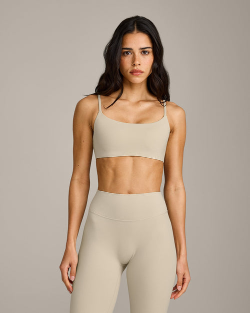 SoftMotion™ Strappy Sports Bra with Gray Logo | Oatmeal