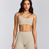 SoftMotion™ Strappy Sports Bra with Gray Logo | Oatmeal