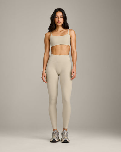 SoftMotion™ Strappy Sports Bra with Gray Logo | Oatmeal