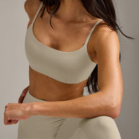 SoftMotion™ Strappy Sports Bra with Gray Logo | Oatmeal