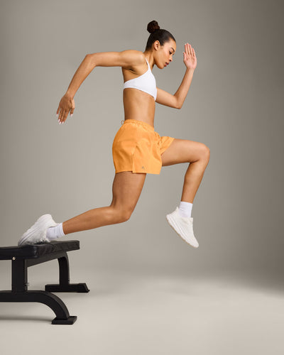 AirMove™ Lined Shorts 4" with Pocket and Reflective Logo | Powdered Orange