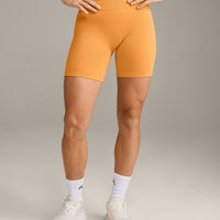 EffortlessLift™ Seamless Mid Rise Shorts with Gray Logo | Powdered Orange