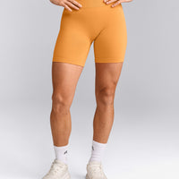EffortlessLift™ Seamless Mid Rise Shorts with Gray Logo | Powdered Orange