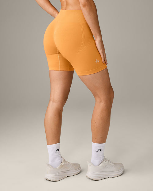 EffortlessLift™ Seamless Mid Rise Shorts with Gray Logo | Powdered Orange