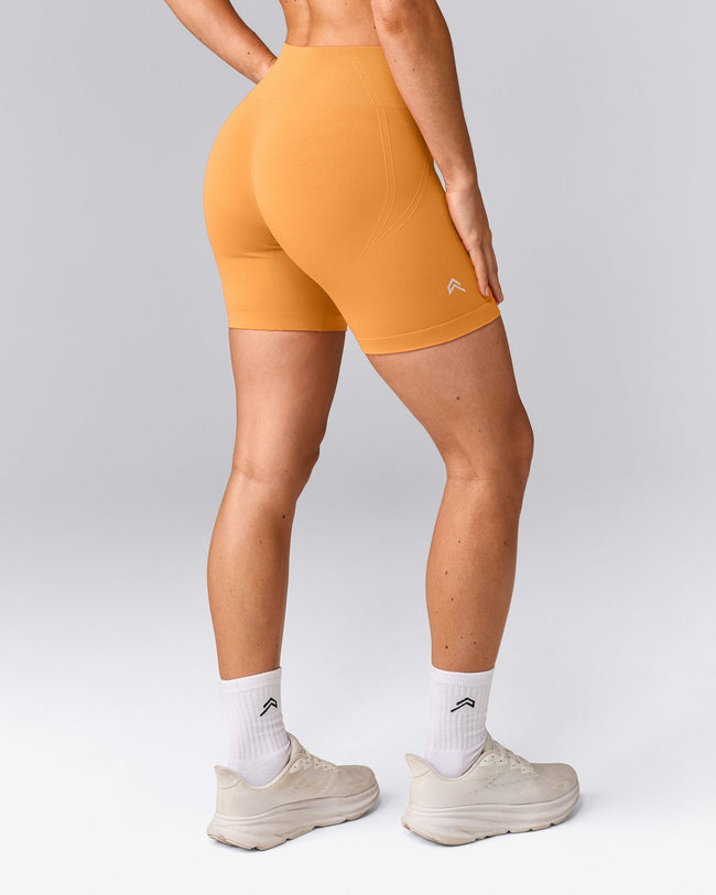 EffortlessLift™ Seamless Mid Rise Shorts with Gray Logo | Powdered Orange