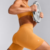 EffortlessLift™ Seamless Mid Rise Shorts with Gray Logo | Powdered Orange