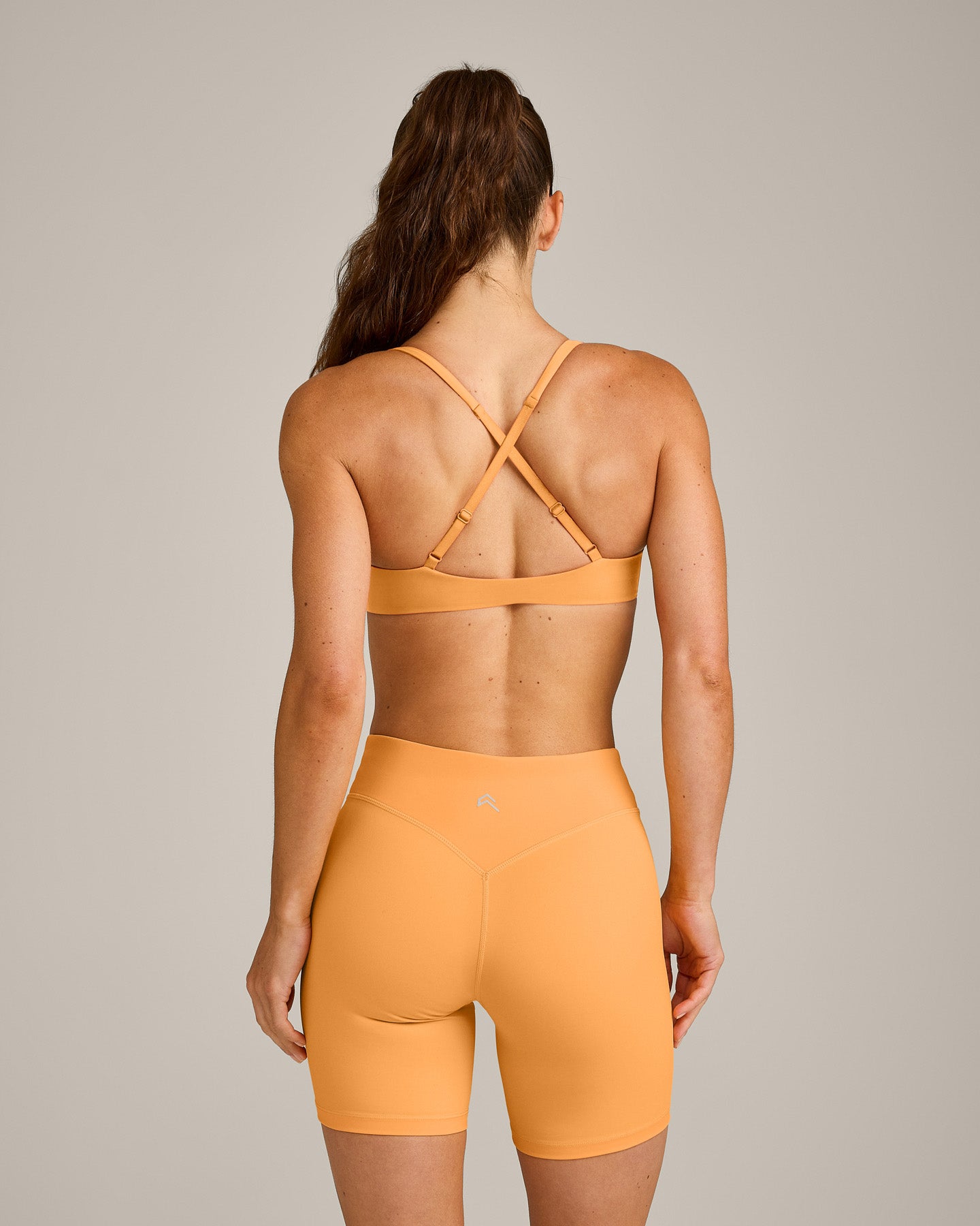 UnifiedMove™ Cross Back Sports Bra with Reflective Logo | Powdered Orange