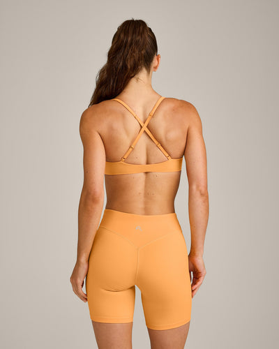 UnifiedMove™ Cross Back Sports Bra with Reflective Logo | Powdered Orange