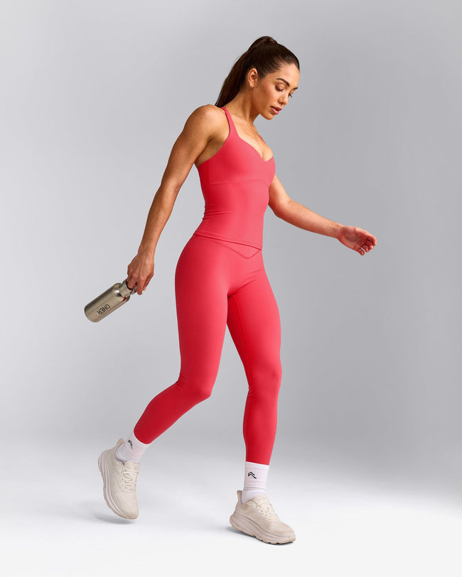 UnifiedMove™ T Back Mid Tank Top with Built in Bra Shelf with Reflective Logo | Charged Pink