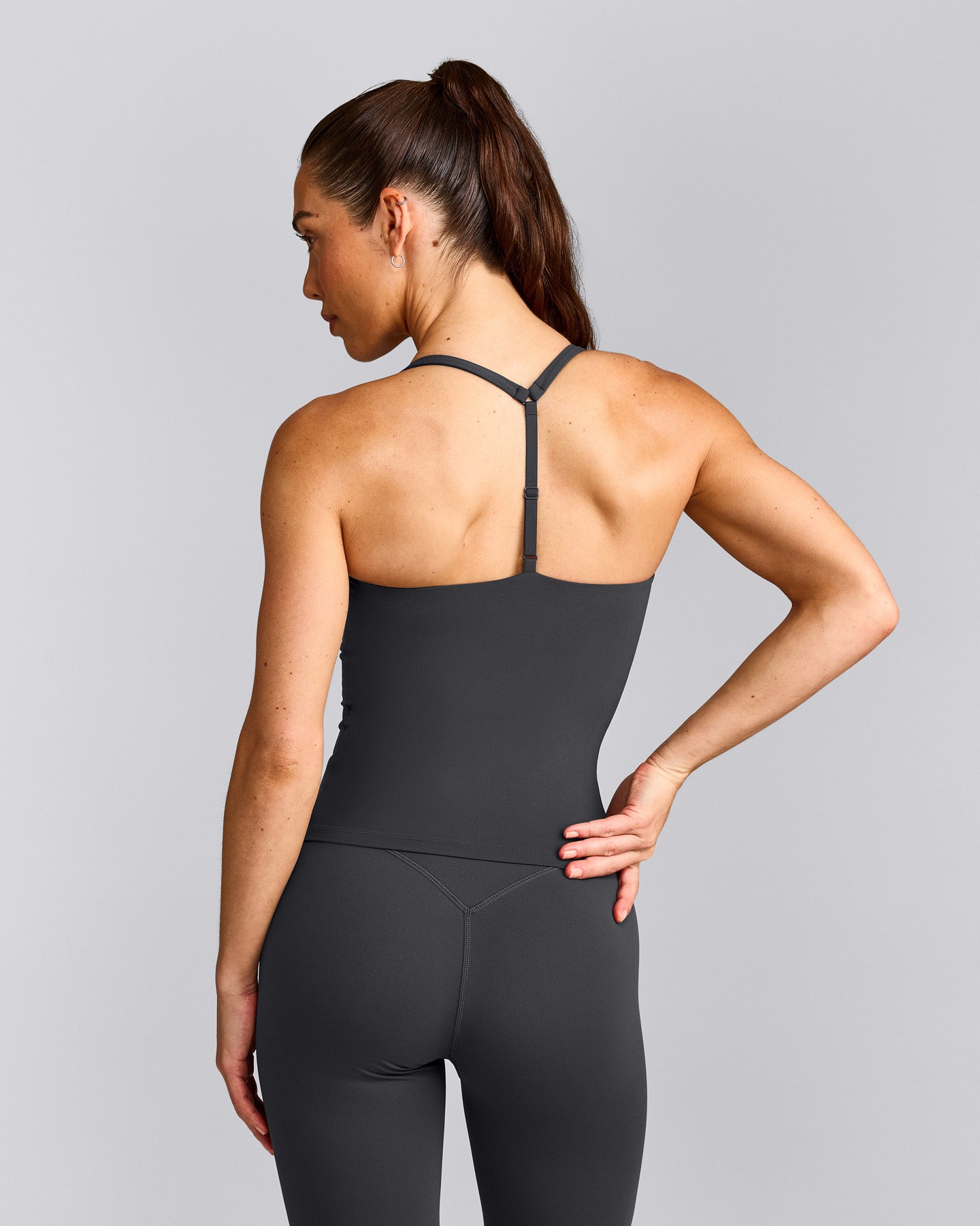 UnifiedMove™ T Back Mid Tank Top with Built in Bra Shelf with Reflective Logo | Coal