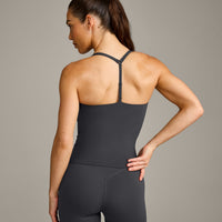 UnifiedMove™ T Back Mid Tank Top with Built in Bra Shelf with Reflective Logo | Coal