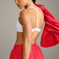 UnifiedMove™ T Back Minimal Bralette with Reflective Logo | White