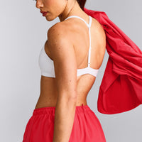 UnifiedMove™ T Back Minimal Bralette with Reflective Logo | White
