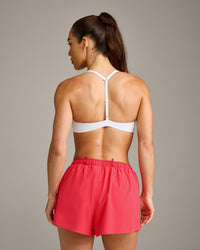 UnifiedMove™ T Back Minimal Bralette with Reflective Logo | White
