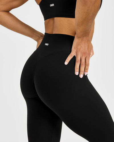 SoftMotion™ High Waisted Leggings with White Logo | Black