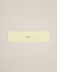 SoftMotion™ Headband with Gray Logo | Pastel Yellow