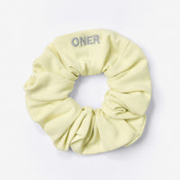 SoftMotion™ Scrunchie with Gray Logo | Pastel Yellow