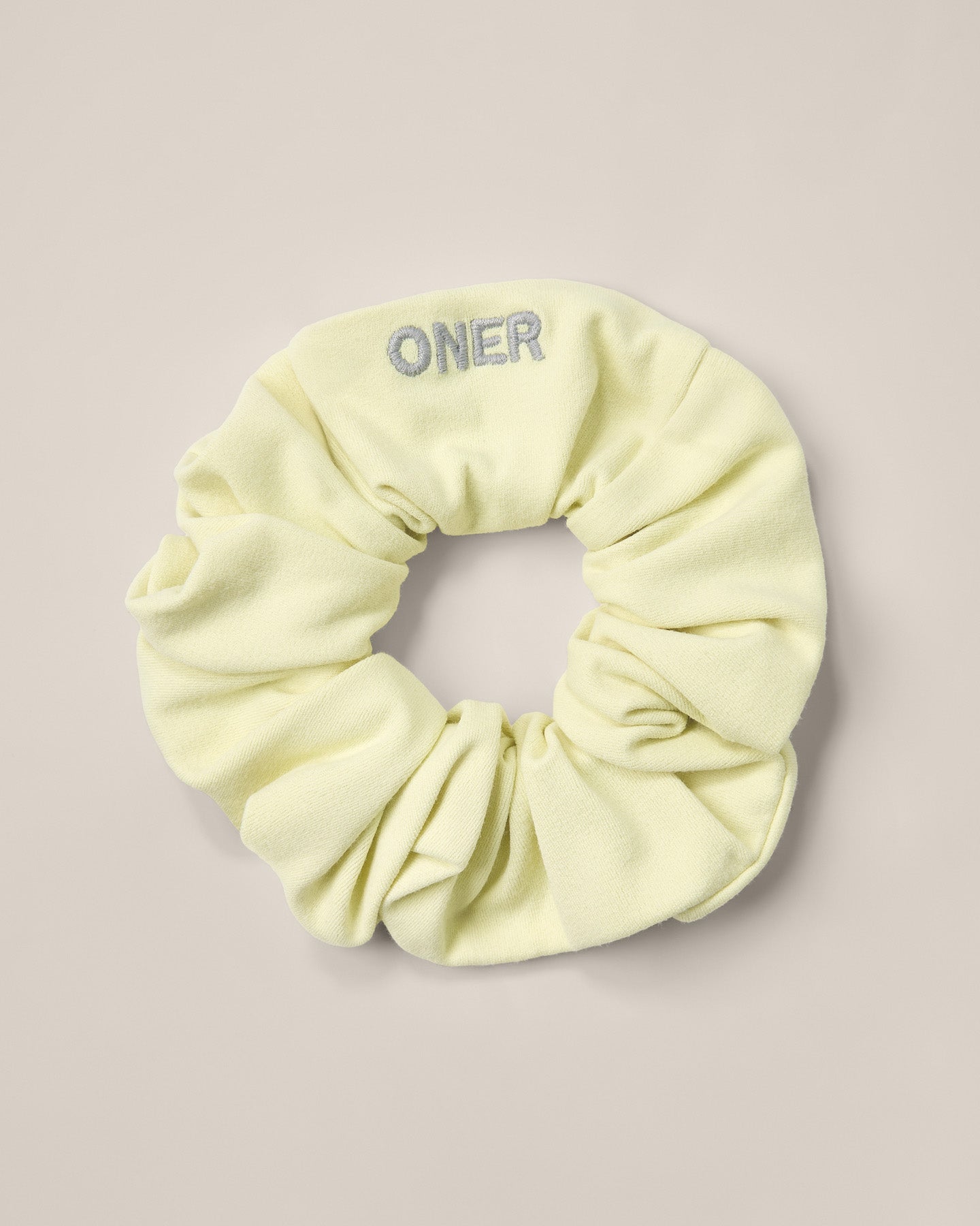 SoftMotion™ Scrunchie with Gray Logo | Pastel Yellow