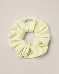 SoftMotion™ Scrunchie with Gray Logo | Pastel Yellow