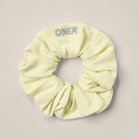 SoftMotion™ Scrunchie with Gray Logo | Pastel Yellow