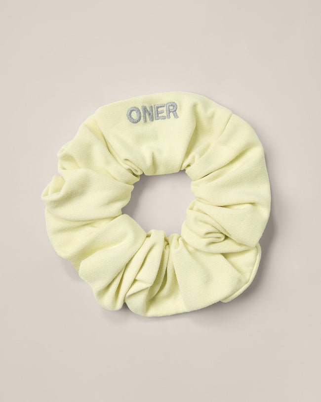 SoftMotion™ Scrunchie with Gray Logo | Pastel Yellow