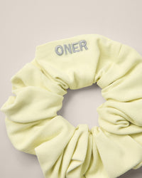 SoftMotion™ Scrunchie with Gray Logo | Pastel Yellow