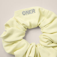 SoftMotion™ Scrunchie with Gray Logo | Pastel Yellow