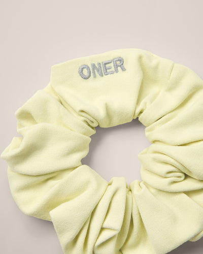 SoftMotion™ Scrunchie with Gray Logo | Pastel Yellow