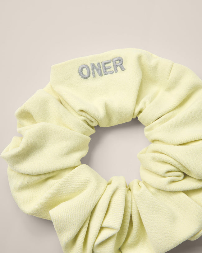 SoftMotion™ Scrunchie with Gray Logo | Pastel Yellow