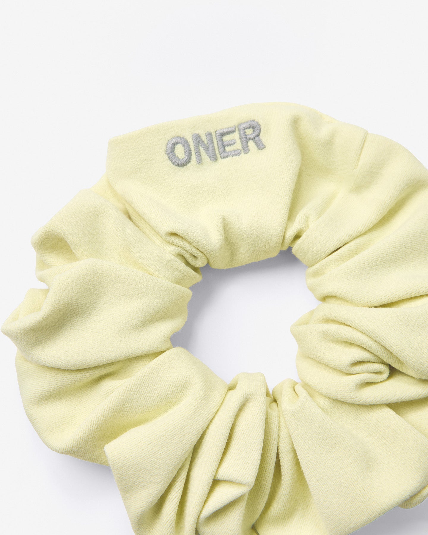SoftMotion™ Scrunchie with Gray Logo | Pastel Yellow