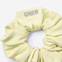 SoftMotion™ Scrunchie with Gray Logo | Pastel Yellow