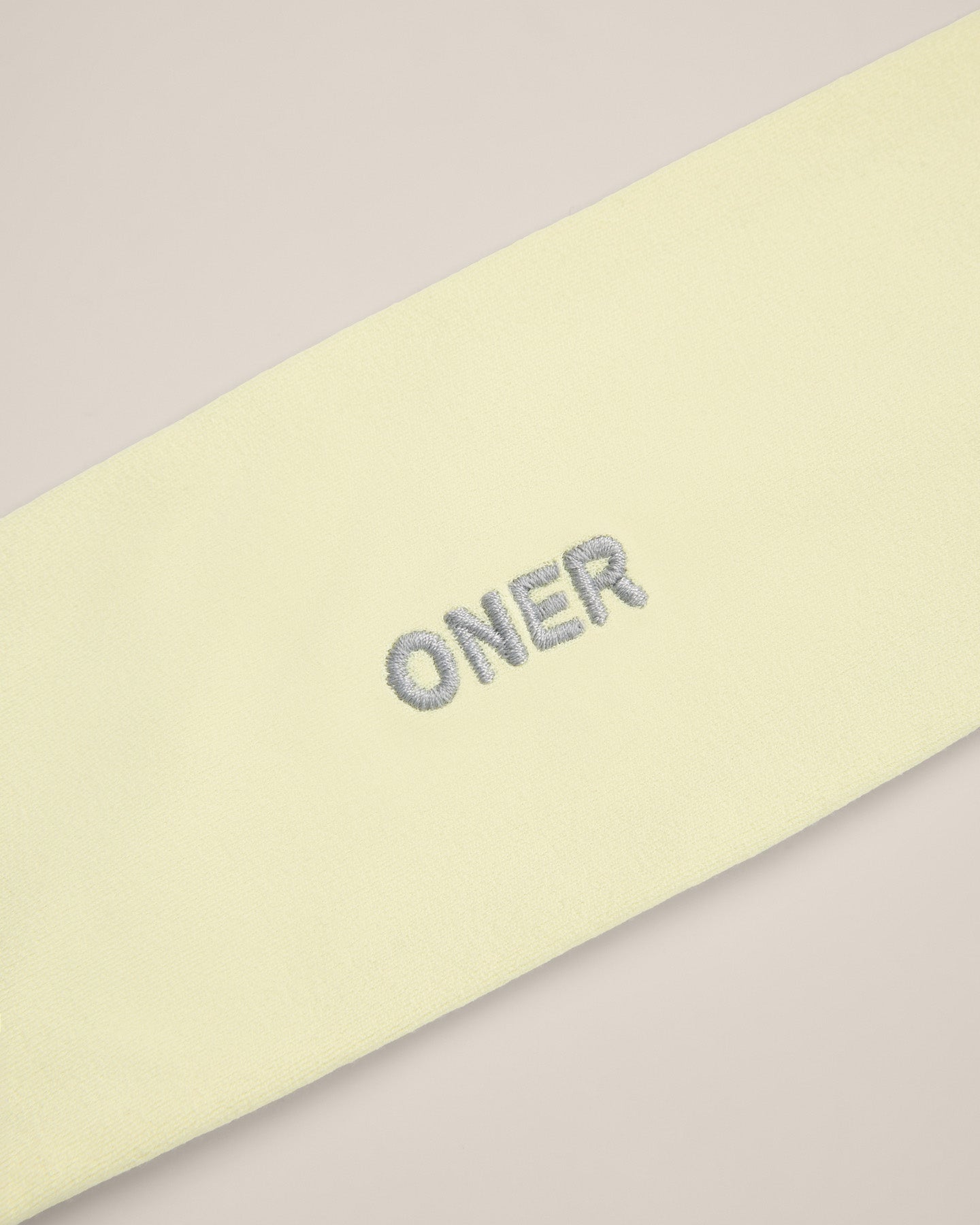 SoftMotion™ Headband with Gray Logo | Pastel Yellow