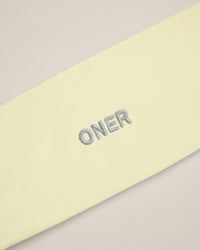 SoftMotion™ Headband with Gray Logo | Pastel Yellow