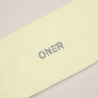 SoftMotion™ Headband with Gray Logo | Pastel Yellow